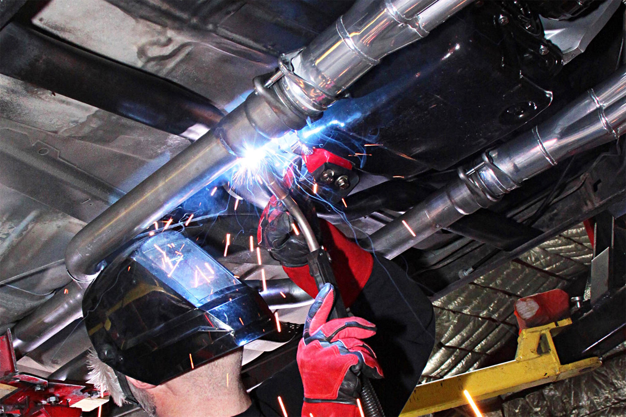 Installing a new exhaust system under your classic Chevy